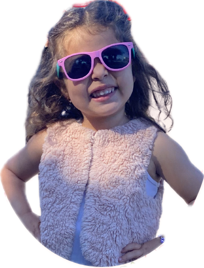 Lia smiling in her pink sunglasses